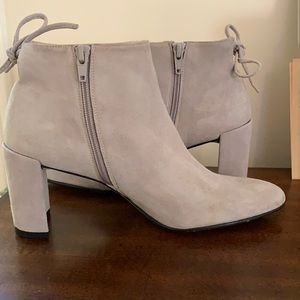 Stuart Weitzman. Light gray bootie, side zip, back decorative tie.